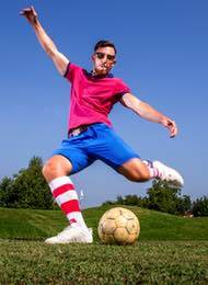 Footgolf player from a stag party just about to kick a ball