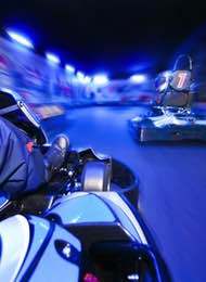 Stag Party Racing Indoor Karts in a blue light