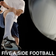 Man kicking a football