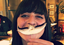 Lady from a hen party Using a Mushroom as a Moustache