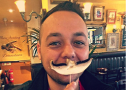 Man from a stag party Using a Mushroom as a Moustache
