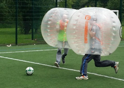 Bubble Footballers Running For The Ball on a stag weekend