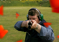 Man Shooting A Clay Pigeon