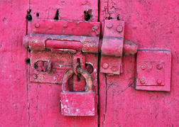 Pink door, bolt and padlock 