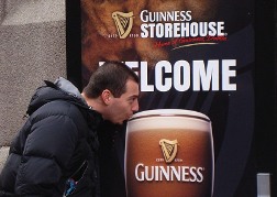 Man pretending to take a sip of Guinness