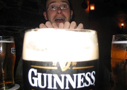 Man Behind Super Sized Glass of Guinness
