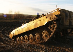 Tank Driving up a muddy hill