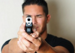 Man Holding A Gun