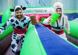 stag party playing West Country Games dressed as cows