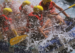 group get hit White water rafting by water spray on their weekend