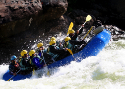 Huge stag party White water rafting hitting frothy water