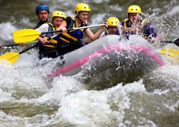 White water rafting stag party hitting choppy water