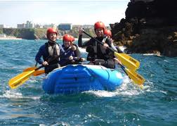 a group White Water Sea Rafting on their stag weekend in Newquay