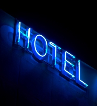 Hotel Sign in Blue Neon Lights