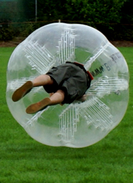 Groom from a stag party on his side playing Bubble Football
