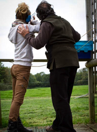 Clay Pigeon Shooting giving a lady from a hen party some coaching