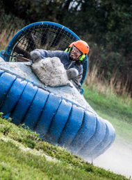 Hovercraft Racing across a watery field