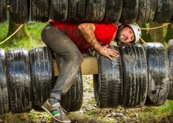 Man From A Stag Party taking part in an Assault Course