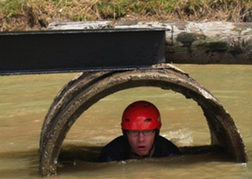  Man From A Stag Party taking part in an Assault Course Cardiff 