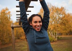 A Lady From A Hen Party Doing An Assault Course