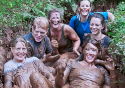 Group Taking Part In An Assault Course