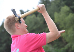 Man From a Stag Party Axe Throwing In A Pink T-shirt