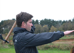 Man From a Stag Party Aiming Axe Throwing