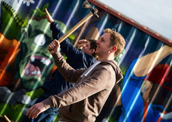 Man From a Stag Party taking aim whilst Axe Throwing