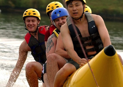 Stag Party Taking Part In Banana Boat Ride