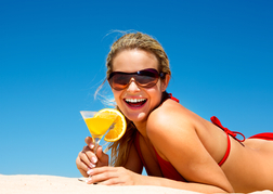 Lady from a hen party Drinking a Cocktail on a Beach 