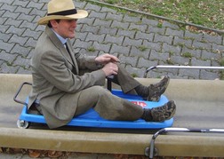 stag party in fancy dress taking part in Bobsledding