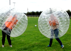 Ladies playing Bubble Football on a hen weekend