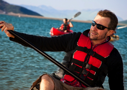 Man Kayaking as part of a stag do