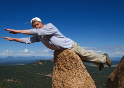 Man Being Silly On a rock