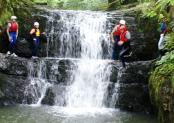 stag party walking by a Waterfall, canyoning