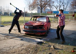 Stag party taking part in the car smash activity