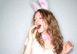 Bunny Eared Woman Eating Chocolate