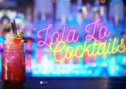 Cocktail and Neon Sign at Lola Lo Bar