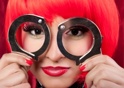 Lady with red hair and handcuffs