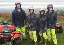 A family posing by their Quad Bikes in North Wales