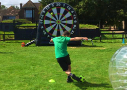 Man playing foot darts