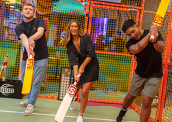 Group playing cricket at Sixes