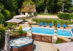 View of the hot tub and pool at Hafod Lodge