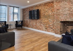 Happy Days apartment Liverpool brick wall living room