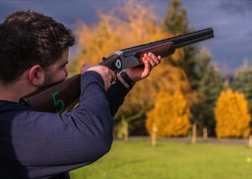 A member of the stag party firing rifle - Laser Clays Hereford 