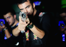 Man aiming playing Laser Tag