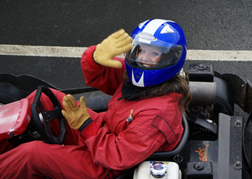 Hen Saluting from a Kart