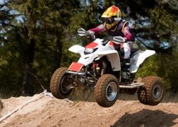 Quad bike going over a hump on a trek