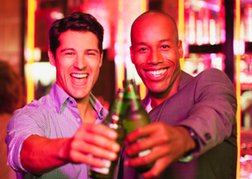 Smiling Men Enjoying A Beer