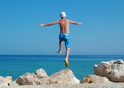 man jumping into the sea